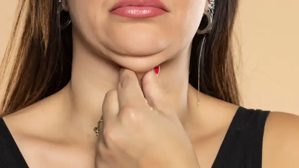 An image of a woman with double chin, sad, worried : Non Surgical Double Chin Removal Treatment in Wooburn Green, UK