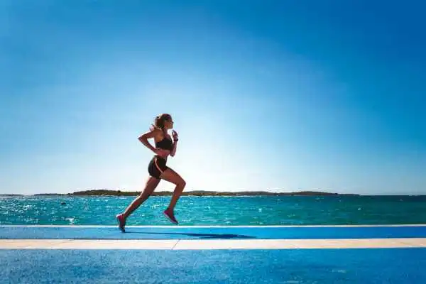 Woman running showing strong leg muscle Wooburn Green